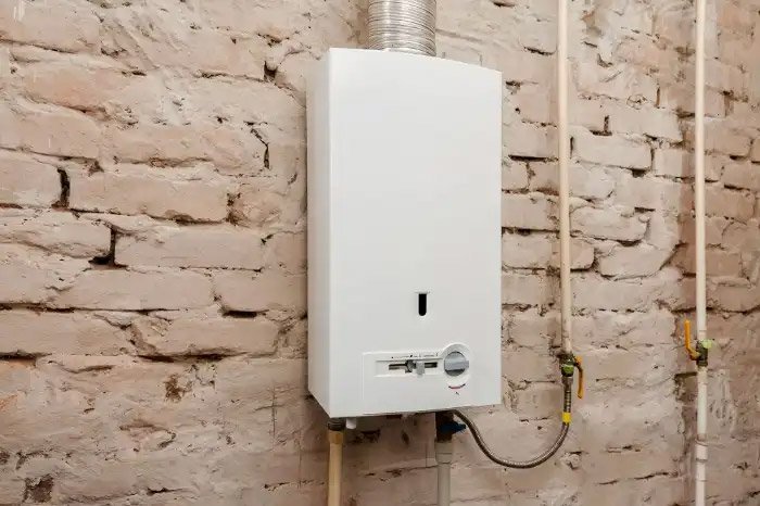 instant hot water system installed on the brick wall of a house